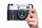 Classic 35mm photo camera in hand