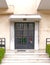 Classic `70s apartment building entrance iron and glass door