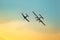 Classic airplanes performing flight at nightfall. Retro Style