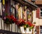 Classic Alsatian windows in a half-timbered house, decorated with wooden carvings and flowers