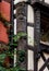 Classic Alsatian windows in a half-timbered house, decorated with wooden carvings and flowers