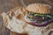 Classic american burger, fast food on wood background