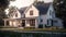 Classic American suburban modern farmhouse. Two story, white siding walls, dark shingle roof, spacious porch, neatly