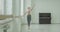 Classic ballet dancer exercising pounte at barre