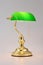 Classic Banker desk lamp with gold pull chain isolated on white background