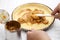 Classic banoffee pie recipe; spread the caramel sauce over the baked pie crust with a spatula.
