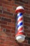Classic Barber Shop Pole on Brick