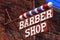 Classic Barber Shop Sign on Brick