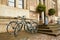 A classic bicycle parked at a pole on a street in Dresden