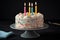 classic birthday cake with colorful, piped frosting and sprinkles