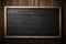 A classic blackboard finds its place on a textured wooden wall