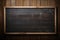 A classic blackboard finds its place on a textured wooden wall