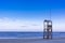 Classic Blue beach sunrise with lifeguard wooden tower