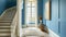Classic blue hallway interior with tall window and wooden elements