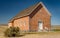 Classic Brick square old building in rural Idaho on the plane