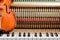 classic brown violin on the close up image of grand piano keys and interior background