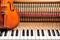 classic brown violin on the close up image of grand piano keys and interior background