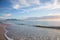 Classic Cape TOwn and Table Mountain view. Late afternoon with sun low and some cloud cover with ocean and waves in foreground