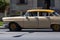 A classic car driver on the street in havana city