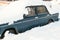 Classic car in snowdrift. Snow-covered car blocked after heavy snowstorm