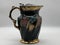 Classic ceramic pitcher with intricate gold detailing around the handles and spout