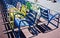 The classic chairs painted with the colors of the jerseys of the cycling Tour de France on the Promenade des Anglais in Nice