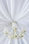 Classic chandelier hanging on ceiling made of white cloth