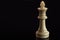 Classic Chess White King on black surface, isolated