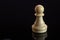 Classic Chess White Pawn on black surface, isolated