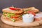 Classic club sandwich with bacon and vegetables