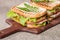 Classic club sandwich with bacon and vegetables