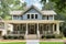 classic craftsman exterior with wraparound porch and double front doors