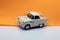 Classic, cream-colored, miniature car model
