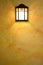 Classic dark brown lamp on yellow abstract wall