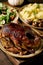 Classic dish roasted glazed duck with apples and garnish