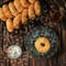 Classic Donuts with Sugar Dusting for Breakfast on Wooden Table