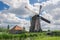 Classic dutch windmill with clouds in the background