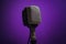 Classic dynamic microphone on a purple background