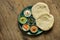 Classic eastern snacks with pita - meze. Set in small bowl - Hummus, hot pepper paste often with walnuts, yogurt, eggplant paste