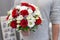 Classic emotional wedding bouquet of white and red roses