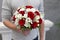 Classic emotional wedding bouquet of white and red roses