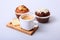 Classic espresso in white cup with homemade cake and chocolate on white background.