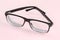 Classic eyeglasses in black plastic frame with partly folded temples