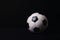 Classic football ball isolated on a black background with copy space for publicity and advertising. Real photo, traditional soccer