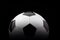Classic football soccer ball isolated on black background