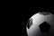 Classic football soccer ball isolated on black background