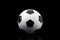 Classic football soccer ball isolated on black background