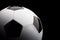 Classic football soccer ball isolated on black background