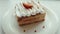 Classic french dessert millefeuille on a wooden board. Napoleon cake on tray or table with mint and a cup of coffee and flower