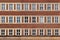 Classic front flat house facade pattern from red brick with whit